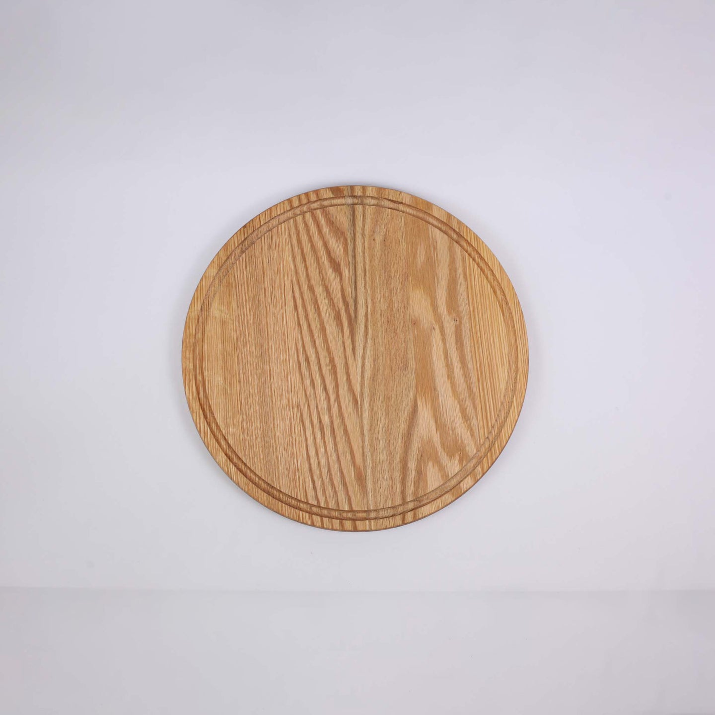 Round wooden cutting and serving board