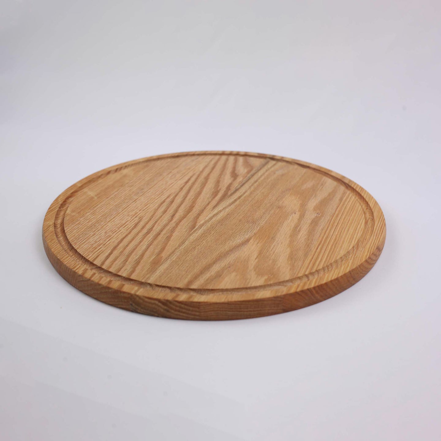 Round wooden cutting and serving board