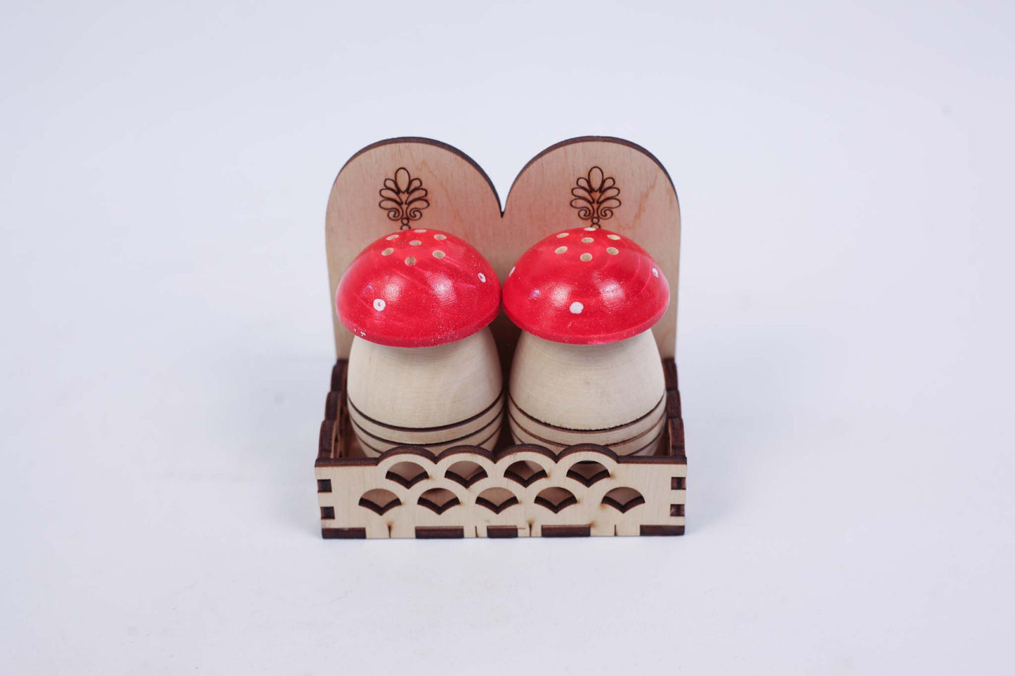 Two Small Salt Shakers (set with two red caps)