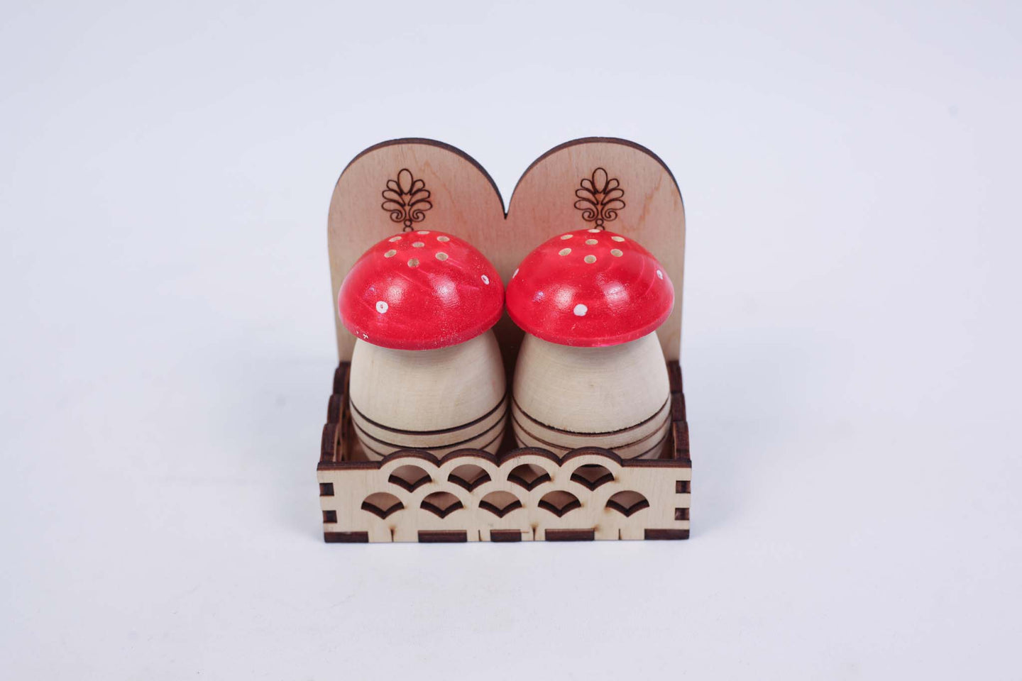 Two Small Salt Shakers (set with two red caps)