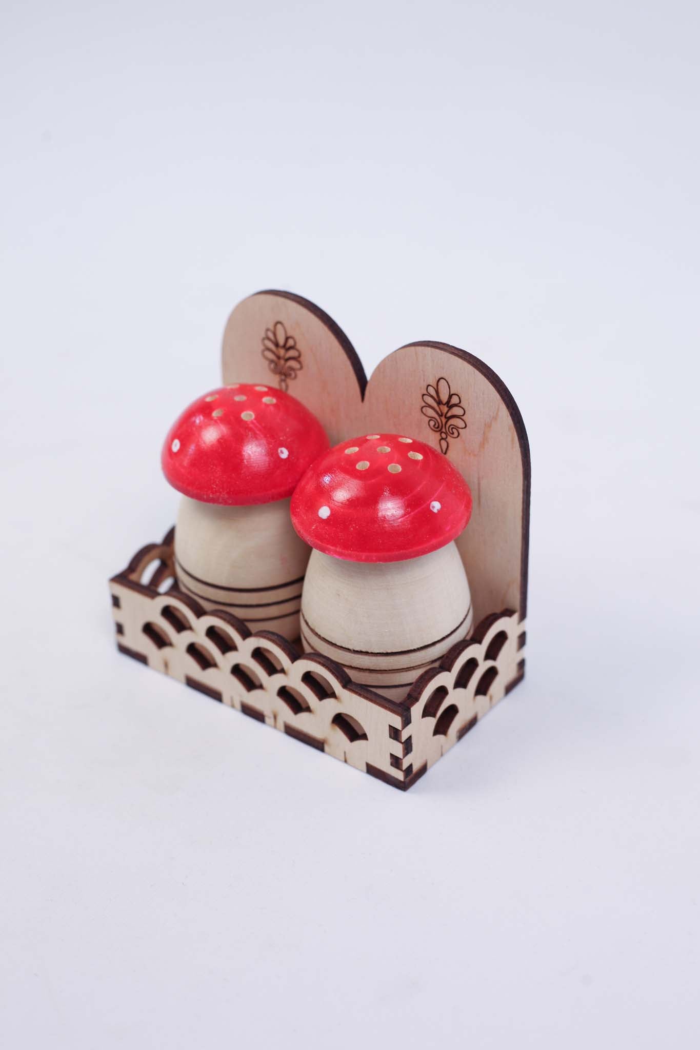 Two Small Salt Shakers (set with two red caps)