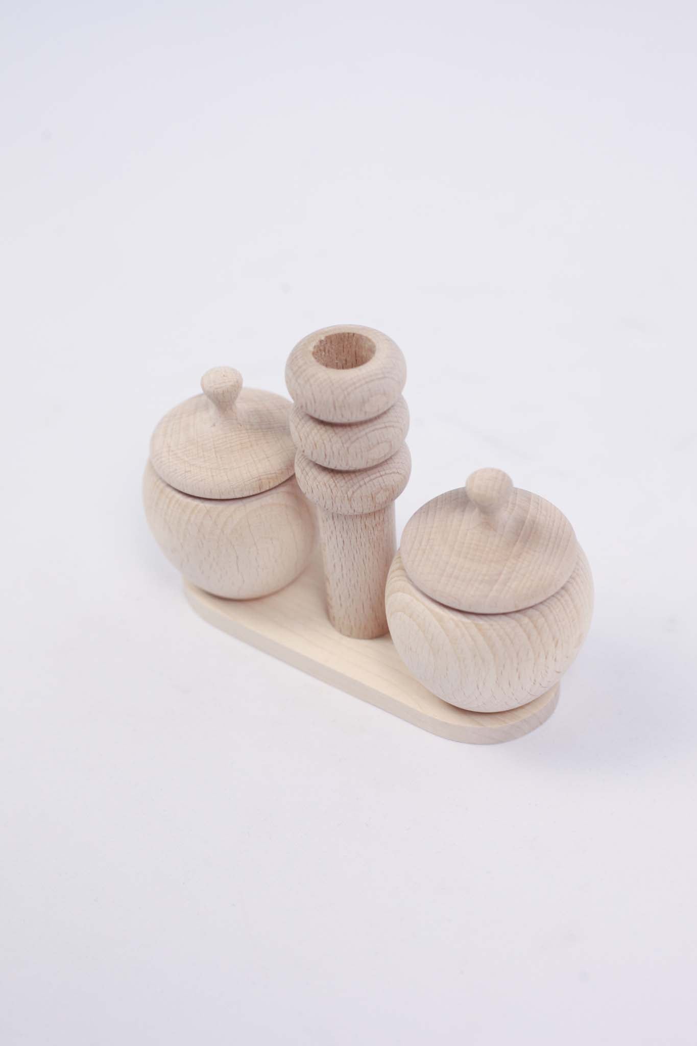 Two Small Salt Shakers with Lids, Handles and a Pillar (set)