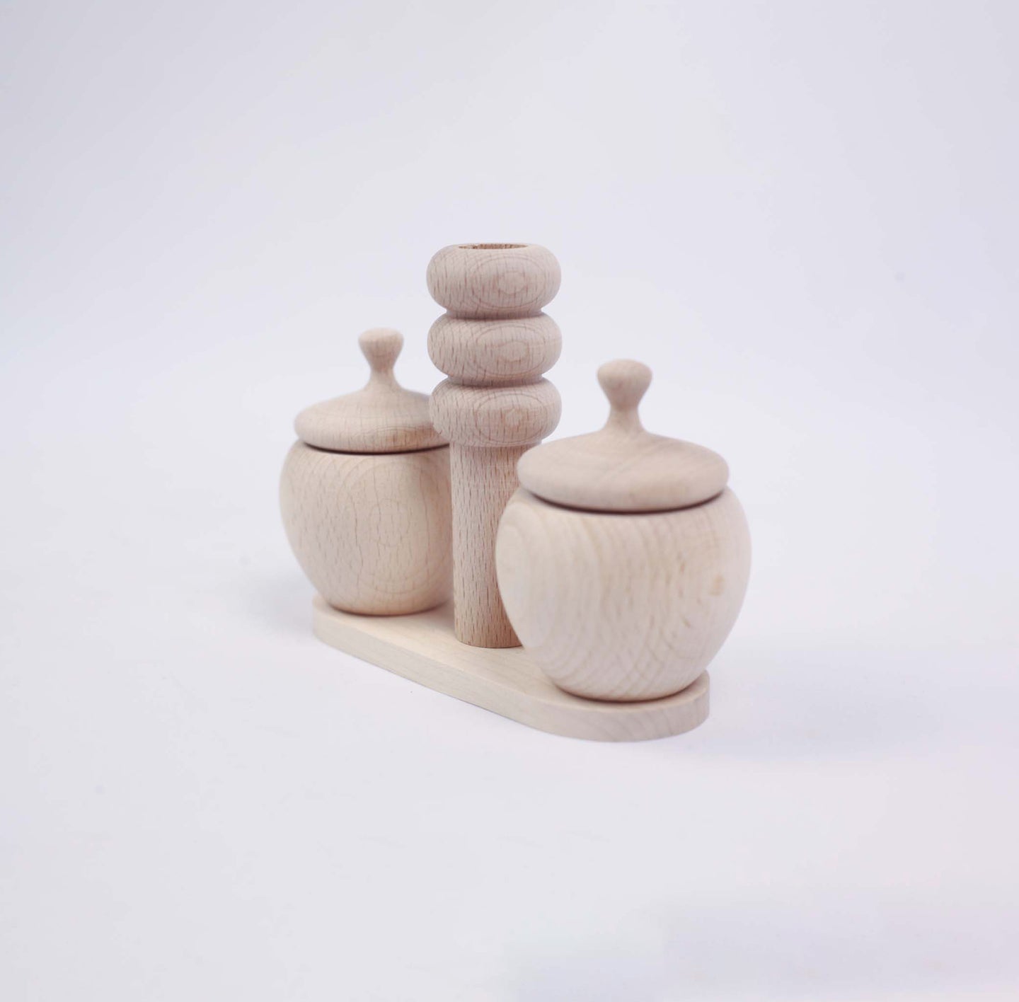 Two Small Salt Shakers with Lids, Handles and a Pillar (set)